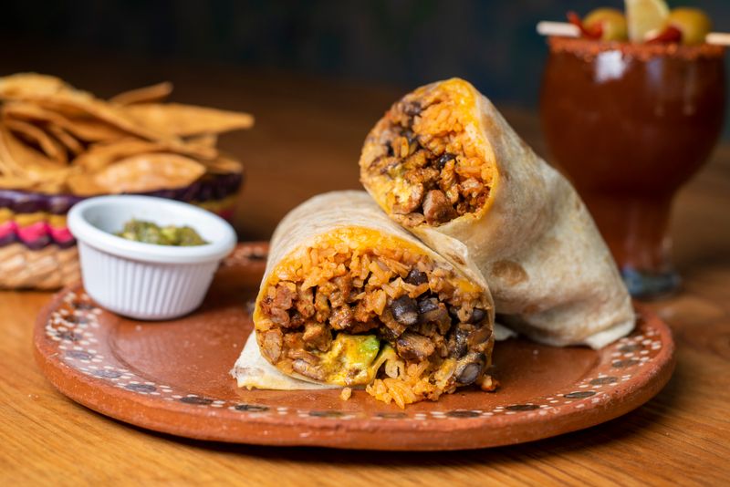 Chuys burrito grande with rice and beans